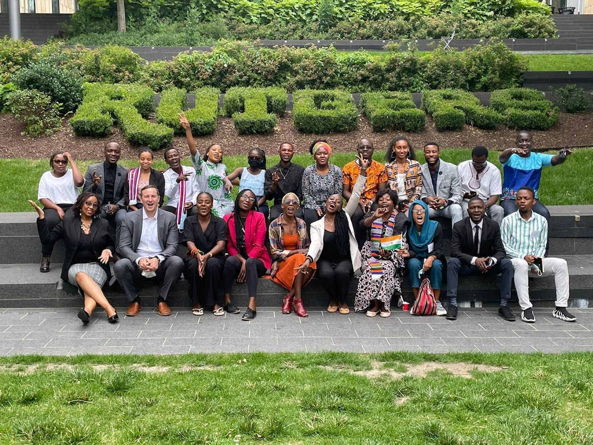 Mandela Fellows in front of Rutgers bushes