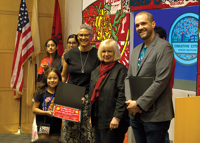 Bloustein School professor Barbara Faga (second from right) and coLAB Arts Director of Education John Keller (far right) presented students with their participation certificates.