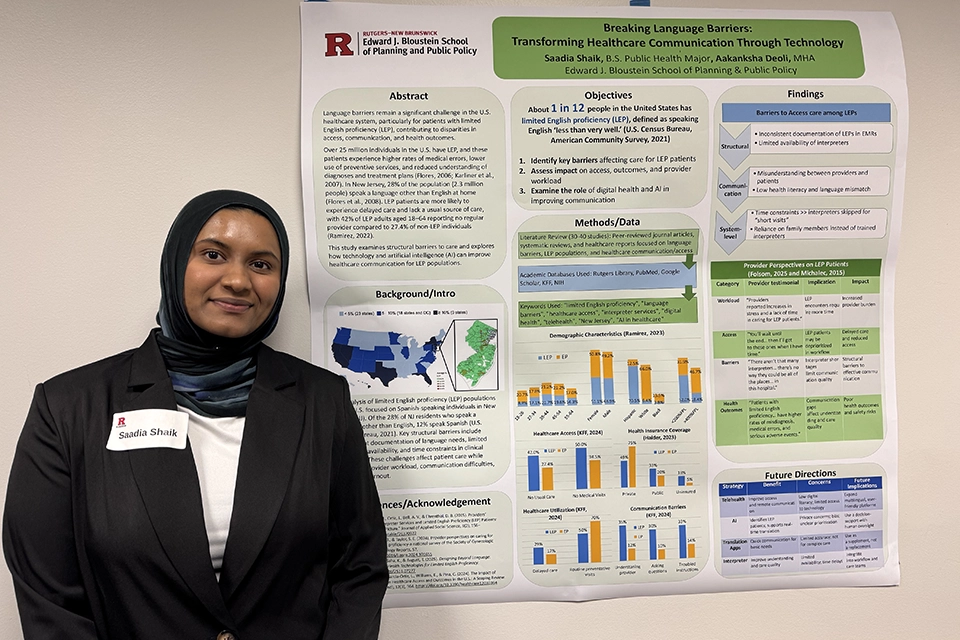 Saadia Shaik, B.S. Public Health candidate, first place winner of undergraduate best poster competition, stands in front of her colorful poster titled "Breaking Language Barriers: Transforming Healthcare Communications Through Technology."